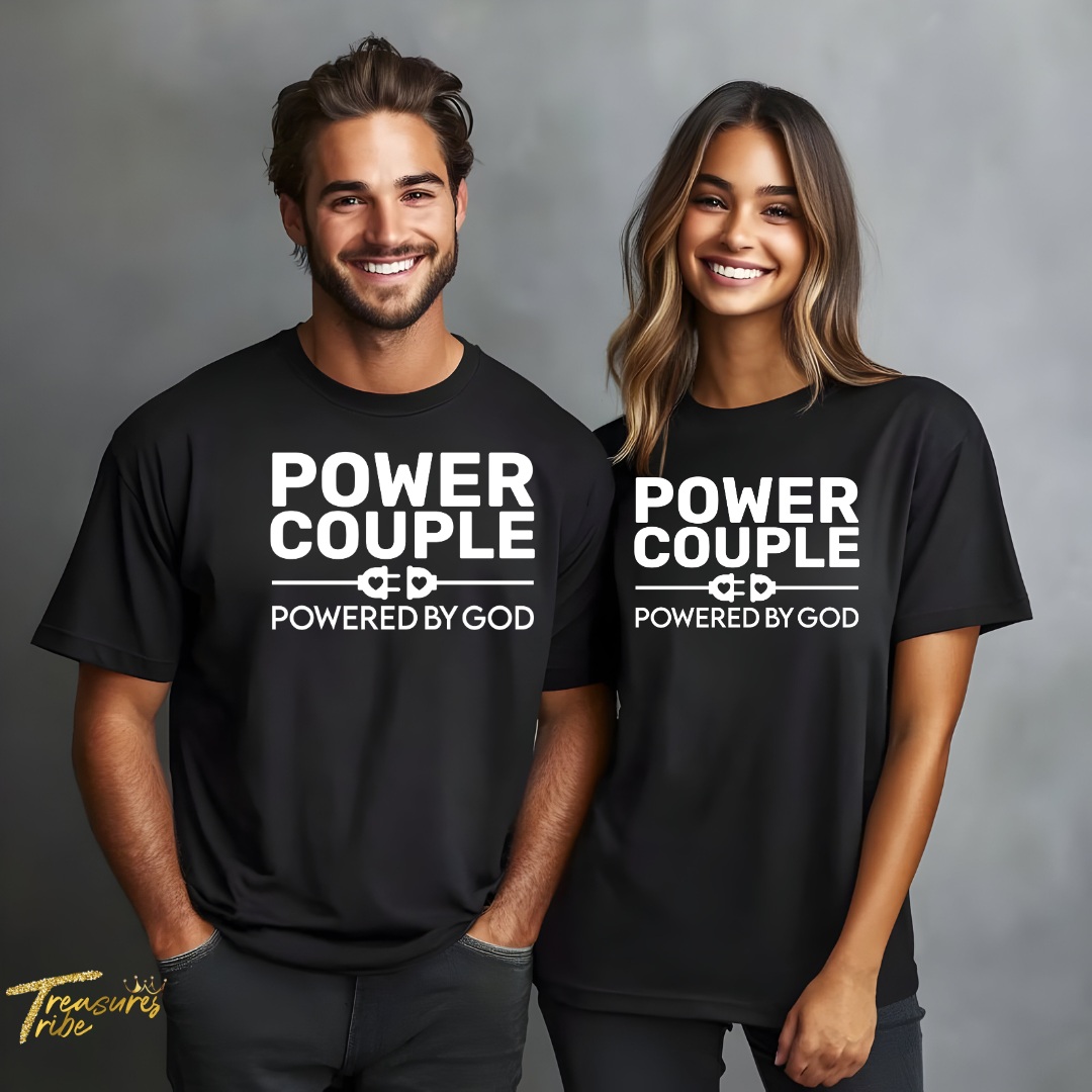 Two people wearing black 'Power Couple Powered by God' t-shirts on a gray background.
