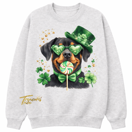 Gray sweatshirt with a Rottweiler wearing a green top hat and heart-shaped sunglasses, holding a lollipop with shamrocks on a white background.